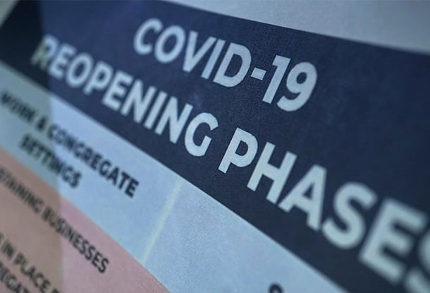 photo: document with title "COVID-19 reopening phases" (iStockphoto)