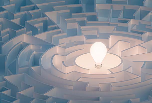 image: lightbulb in centre of a maze (iStockphoto)