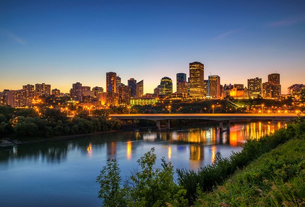 Edmonton downtown and the Saskatchewan River at night - (iStockphoto)