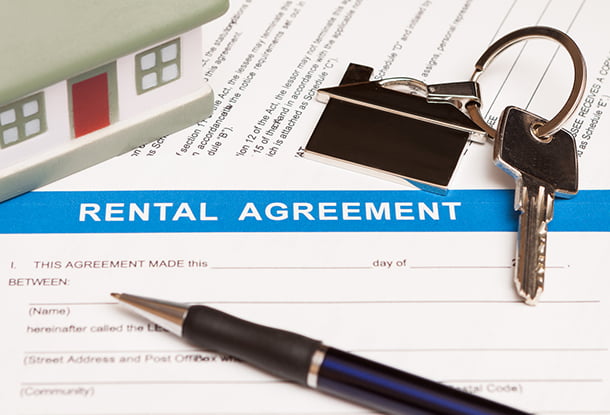 Rental agreement with pen and keys (iStockphoto)