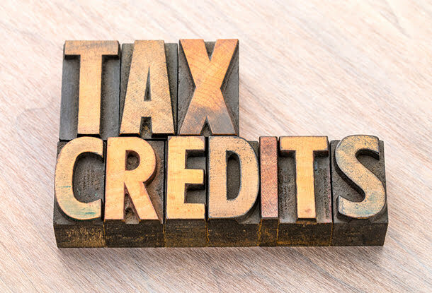 Tax credits words abstract in wood type (iStockphoto)