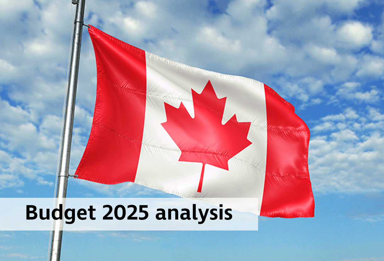 photo: Flag of Canada against a lightly cloudy blue sky (iStockphoto)