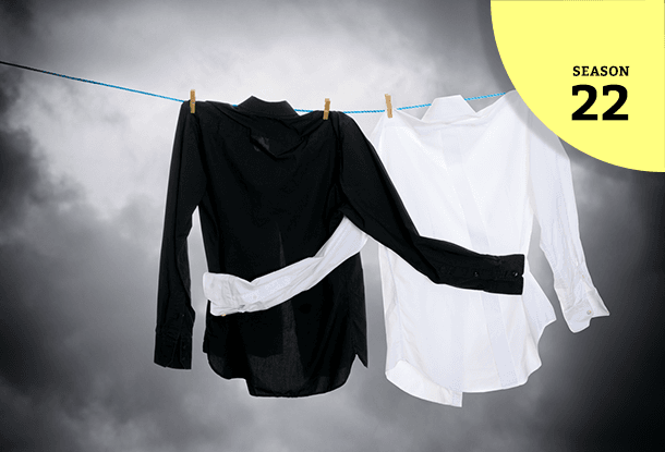 image: black and white shirts hugging on a washing line (iStockphoto)